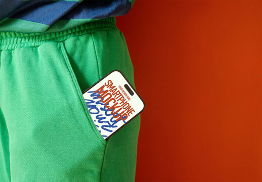 Mockup of Smartphone in Green Pants Pocket