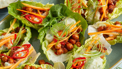 Chickpeas in lettuce leaf with yogurt