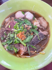 The closed up of Thai noodles with meat ball. Select and soft focus.