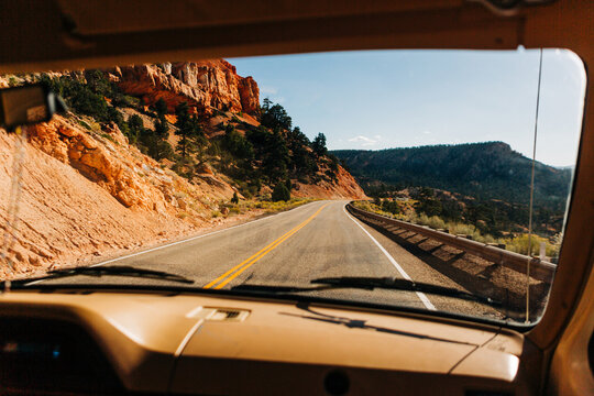 Curving Road, Red Rock Cliffs, vintage vehicle near Grand Staircase - Powered by Adobe