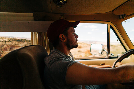 Man driving vintage van in desert, Highway 12, Escalante - Powered by Adobe