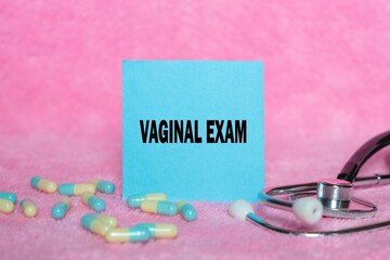 Vaginal Exam writing concept on sticky note isolated on pink background. stethoscope as decoration.