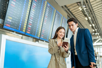 Asian businesswoman passenger standing outdoors of airport terminal. 