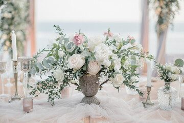 lovely Table setting for magnificent composition from flowers at a wedding , Centerpiece white and orange color palette flower bouquet arrangement