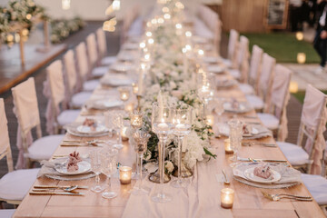 lovely Table setting for magnificent composition from flowers at a wedding , Centerpiece white and orange color palette flower bouquet arrangement