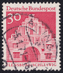 Norder Gate (Flensburg, Schleswig) on a 1967 Germany vintage postage stamp. German buildings from twelve centuries Series