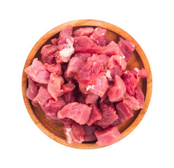 slices of raw beef on a wooden bowl with a white isolated background
