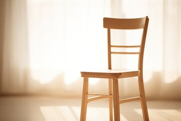 lone chair by window bathed in soft morning light suggests anticipation and patience