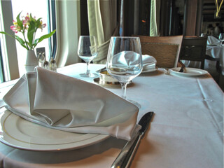 Formal and elegant ocean view dining room restaurant onboard luxury cruiseship or cruise ship liner...
