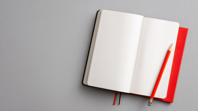 An open blank notebook with a red pencil - Powered by Adobe