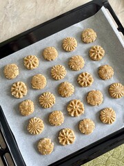 oatmeal cookie dough on parchment paper on a baking sheet
