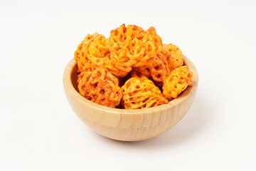 A pile of spicy Indonesian crackers or Kerupuk with spiral twists, coated in red-orange chili powder and rich spices. Bold, flavorful, and appetite-boosting. Photographed against a white background.