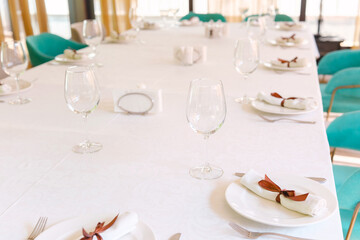 Elegant dining setup with glassware and table decorations for special occasion
