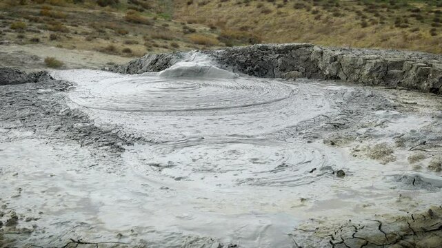 close up of a single bubble formation due to the gas from the earth at Gobustan mud volcanoes