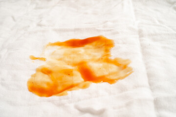 Dirty tomato sauce stain or ketchup on cloth to wash with washing powder, cleaning housework.