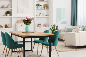Dining table and chairs in room. Interior design with color accent