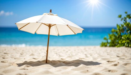 Beach umbrellas and chairs dot the sandy coast, inviting relaxation under the summer sun