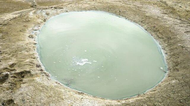 A natural bubbling oily surface of the liquid at Gobustan mud volcanoes
