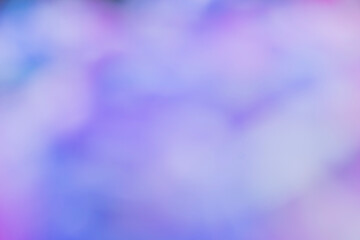 Image features an abstract, colorful blur with shades of pink, purple, and blue, creating a dreamy...