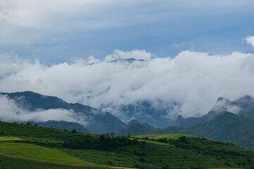 Naklejka premium mountains and clouds
