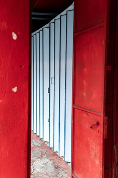 Red frame and blue folding door in Georgetown, Malaysia