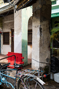 Old bicycle and columns in Georgetown, Malaysia