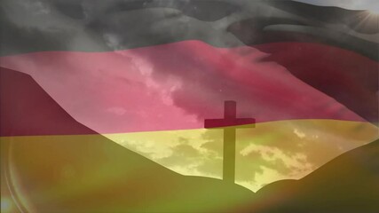 Wind blowing, German flag waving over cross on hill, clouds drifting, unveiling glowing horizon - Powered by Adobe