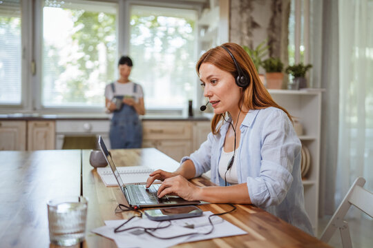 smile redhead woman operator with headset work from home, remote concept