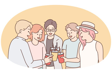 Group of young guys and girls drink drinks during holiday party from disposable cups with straw
