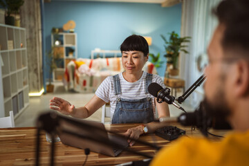 Japanese woman host and guest in podcast at home studio