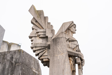 Naklejka premium Geometric angel warrior statue with a sword