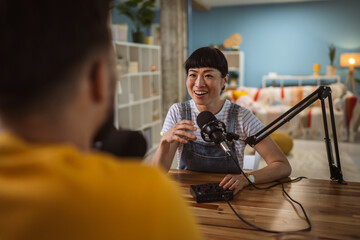 Japanese woman host and guest in podcast at home studio