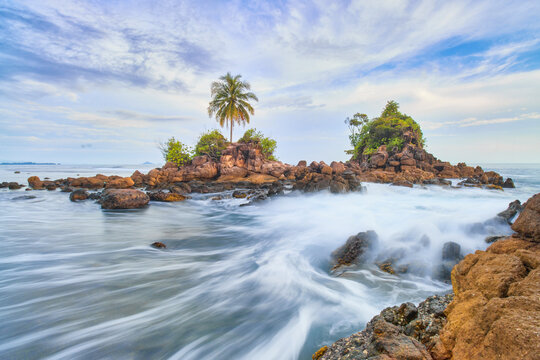Taluak Sikulo, Large rocks and corals on the edge of a beautiful beach. Pesisir Selatan Regency, West Sumatra, Indonesia.