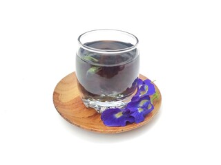 Butterfly pea flower boiled water in glass on white background. healthy drink lifestyle