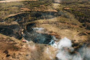 Wild Open Fire Destroys Grass. Aerial View Of Dry Grass Burns During Drought And Hot Weather. Concept Of Save Nature. Bush Fire And Smoke In Meadow Field. Nature In Danger. Natural Disaster