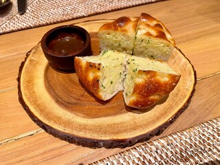 Garlic bread served with herbal sauce