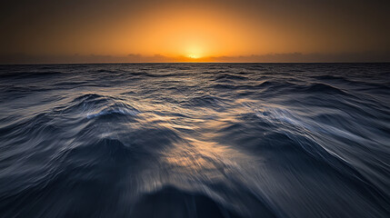 Tranquil ocean view with calm waves under golden sunset, minimalist seascape with copy space, conveying peace, relaxation and freedom of coastal life.