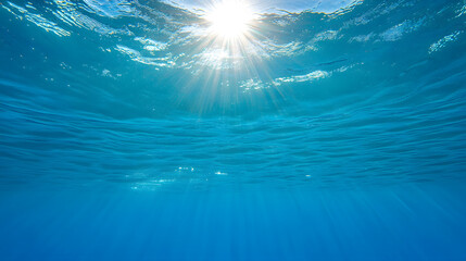 Ocean shimmer sun rays bright blue water underwater light reflection peaceful nature scene