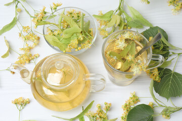 cup of herbal tea with linden flowers on wooden background