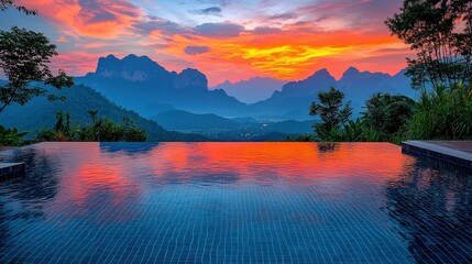 Sunset over mountains, reflected in pool