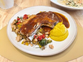 Pork chops served with mashed potatoes and stir fried spicy Brussels sprout. Western food,...