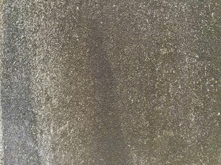 Weathered concrete wall with black dirt background and texture