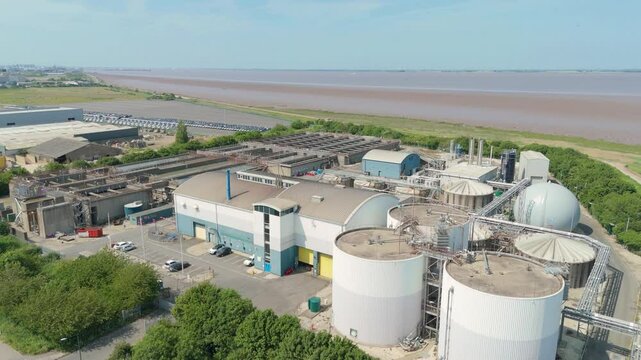 Aerial drone view of Anglian water Treatment plant near Grimsby England. Chemical removal of contaminants, clean drinking water, Humber estuary banks, infrastructure circular sediment pools filters