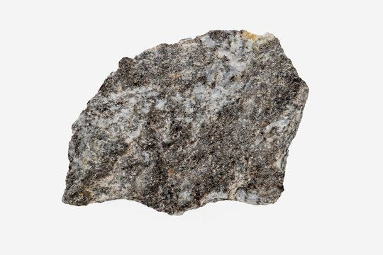 Close-up of gneiss mineral, isolated on white background.