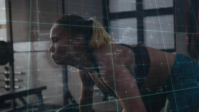 Mid adult woman weightlifter gripping barbell then squatting cleaning and jerking up for health