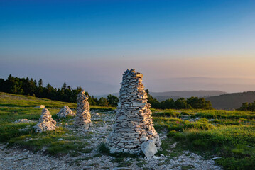 large mountain cairns in a beautiful landscape under blue sky in the Lure mountain in the Vaucluse in France