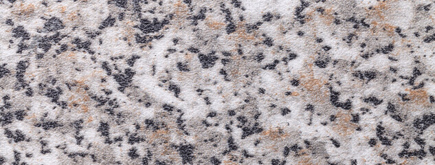 Granite stone texture with marble pattern in beige, black and white tones for kitchen countertop background