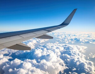 Fototapeta premium Airplane wing view over clouds