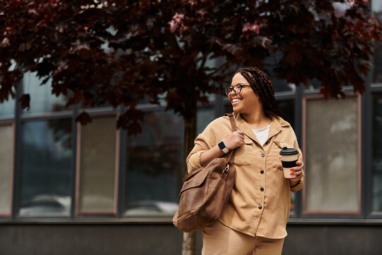 University teacher joyfully walking outside with coffee and bag during a sunny day on campus