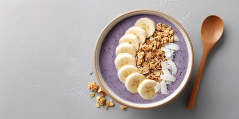 Healthy Breakfast Delight: A colorful, top-down shot showcases a healthy breakfast bowl. Fresh banana slices, granola clusters.